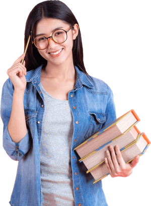 Student with glasses standing and holding a book
